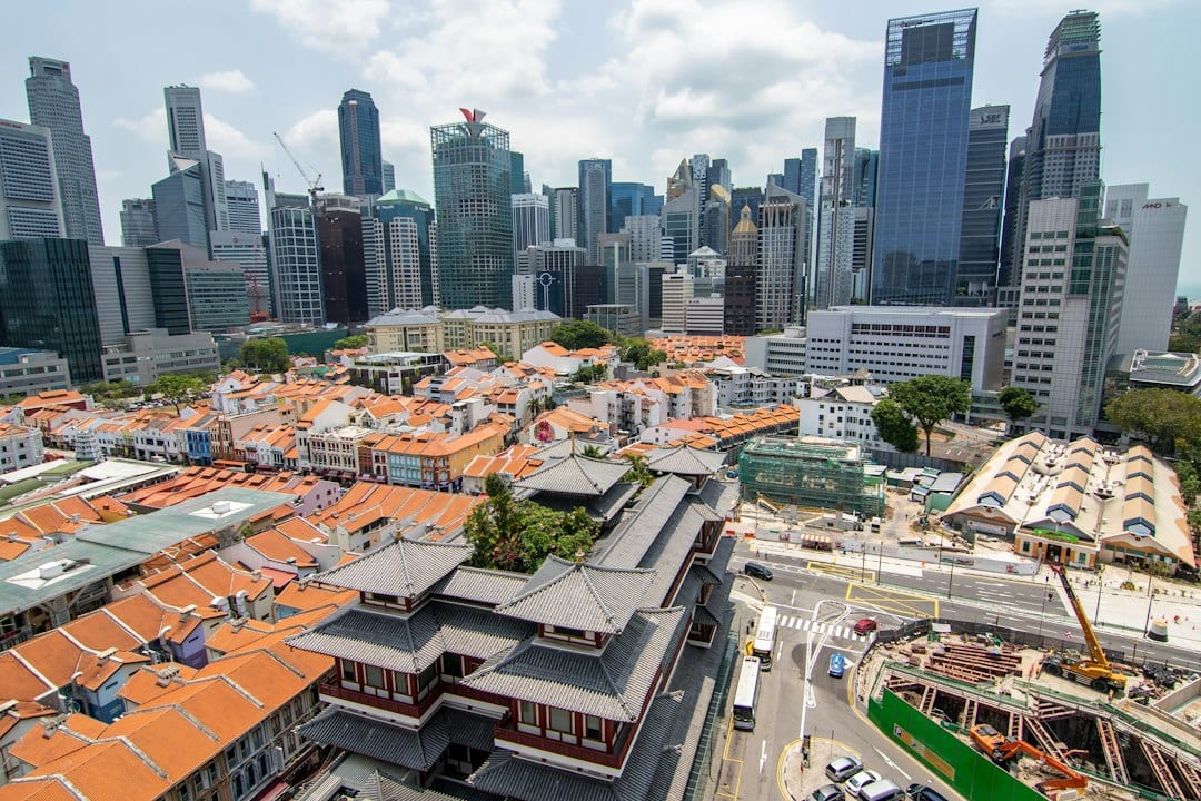 Tree-lined Hillcrest estate street with landed homes in Singapore District 11